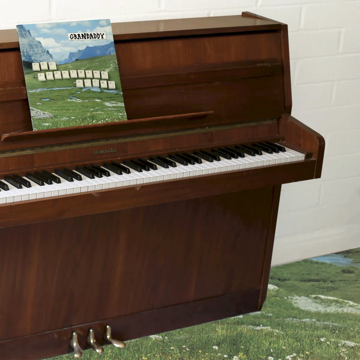 Cover of The Sophtware Slump ….. on a wooden piano