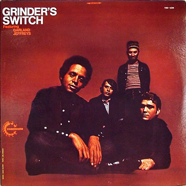 Obal alba Grinder’s Switch Featuring Garland Jeffreys